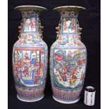 A LARGE PAIR OF 19TH CENTURY CHINESE CANTON FAMILLE PORCELAIN VASES Qing, painted with warriors on h