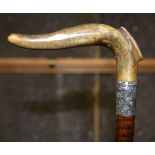A 19TH CENTURY CONTINENTAL CARVED RHINOCEROS HORN WALKING CANE with silver mounts. 88 cm long.