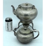 AN UNUSUAL 19TH CENTURY CONTINENTAL SILVER SPIRIT TEAPOT ON STAND together with a matching smaller