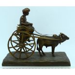 A LOVELY EARLY 20TH CENTURY FRENCH COLD PAINTED BRONZE FIGURE OF A MALE modelled riding upon an oxen