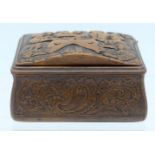 AN 18TH CENTURY EUROPEAN CARVED FRUITWOOD SNUFF BOX decorated with figures holding keys , encased wi