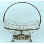 AN EARLY 20TH CENTURY RUSSIAN SILVER CUT GLASS OVAL BASKET in the manner of Karl Faberge, overlaid w