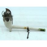 AN ANTIQUE PARTIALLY ENAMELLED CLAY PIPE with white mounts. 12 cm wide.