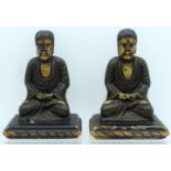 A PAIR OF 19TH CENTURY CHINESE KOREAN LACQUERED WOOD FIGURES OF BUDDHAS modelled with hands clasped