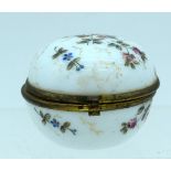 A LATE VICTORIAN OPALINE GLASS PILL BOX AND COVER painted with flowers. 5.5 cm wide.