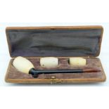AN ANTIQUE MEERSCHAUM AND AMBER PIPE. 14 cm wide.