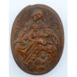 AN 18TH CENTURY CONTINENTAL CARVED FRUITWOOD TREEN SNUFF BOX AND COVER decorated with a saint and ch