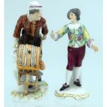 A 19TH CENTURY GERMAN SITZENDORF PORCELAIN FIGURE OF A MALE WITH WHEELBARROW together with another s