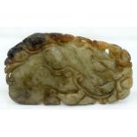 A 19TH CENTURY CHINESE CARVED MUTTON JADE PLAQUE Qing, of naturalistic form. 7 cm x 5.5 cm.