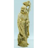 A 19TH CENTURY JAPANESE MEIJI PERIOD CARVED IVORY OKIMONO modelled as a buddha and a hare. 17 cm hig