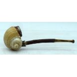 A RARE ANTIQUE CARVED CONCH SHELL PIPE. 14 cm wide.
