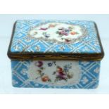 AN 18TH CENTURY ENGLISH ENAMEL RECTANGULAR PILL BOX painted with flowers. 6 cm x 5 cm.