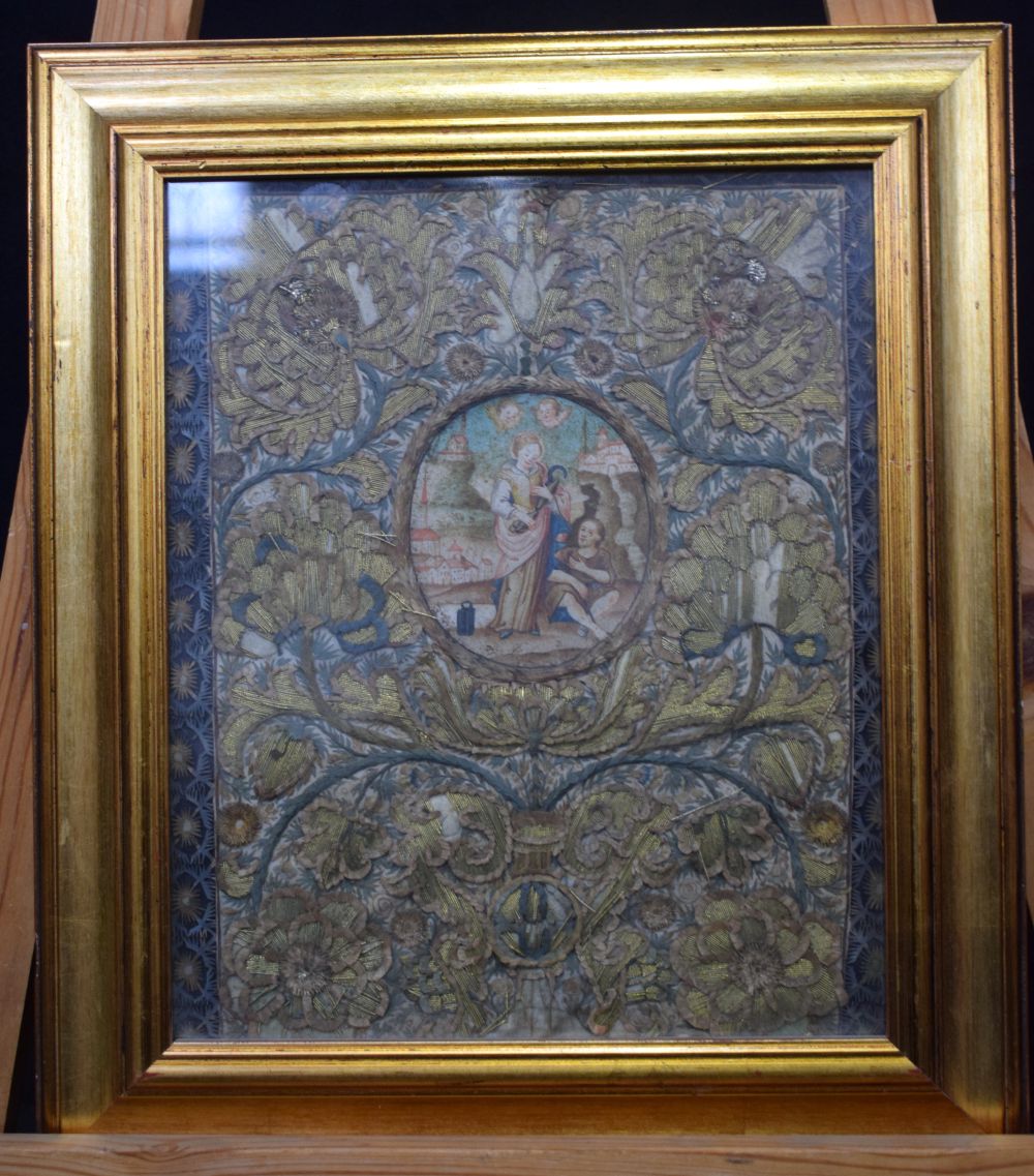 AN EARLY 18TH CENTURY EMBROIDERED ROLLED PAPER WATERCOLOUR LANDSCAPE depicting saints and putti with