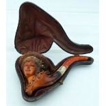 AN ANTIQUE CARVED MEERSCHAUM AND AMBER CLASSICAL LADY PIPE. 15 cm wide.