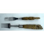 TWO 19TH CENTURY CARVED DUTCH TREEN WOOD HANDLED FORKS. Largest 17 cm long. (2)