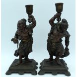 A PAIR OF 19TH CENTURY JAPANESE MEIJI PERIOD BRONZE OKIMONO CANDLESTICKS in the manner of Miyao Eisu