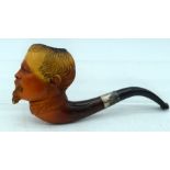 AN ANTIQUE MEERSCHAUM AND AMBER MOUSTACHED GENTLEMAN'S PIPE. 13 cm wide.