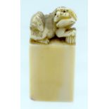 A 19TH CENTURY CHINESE CARVED IVORY SEAL Qing, with Buddhistic lion terminal. 4 cm x 2 cm.