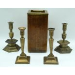 A pair of brass candlesticks together with a pair of Swedish candlesticks and a wooden brass topped