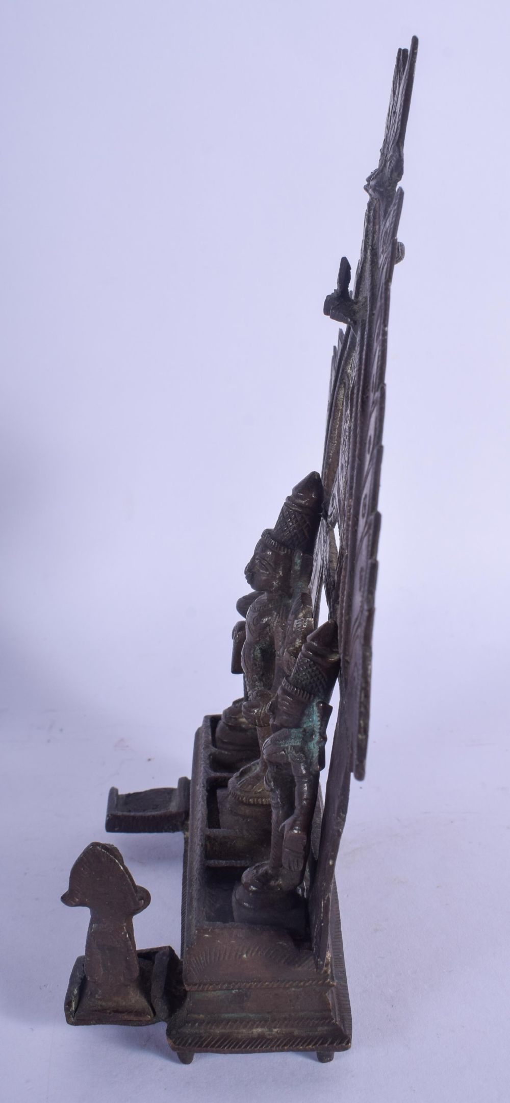 AN 18TH CENTURY INDIAN HINDU BUDDHISTIC BRONZE SHRINE modelled standing in front of a floral plate. - Image 2 of 4