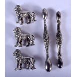 THREE WHITE METAL LIONS and a pair of sterling silver knife rests. 120 grams overall. Largest 11 cm