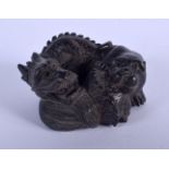 A JAPANESE CARVED BOXWOOD DRAGON OKIMONO. 5 cm x 4 cm.