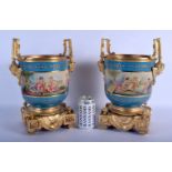 A PAIR OF CONTEMPORARY SEVRES STYLE TWIN HANDLED PORCELAIN CACHE POTS decorated with putti. 33 cm x