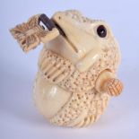 A CHINESE CARVED BONE TAPE MEASURE 20th Century. 4 cm x 3 cm.