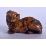 A 19TH CENTURY CHINESE CARVED MUTTON JADE FIGURE OF A BEAST Qing, modelled with its read rearing. 5