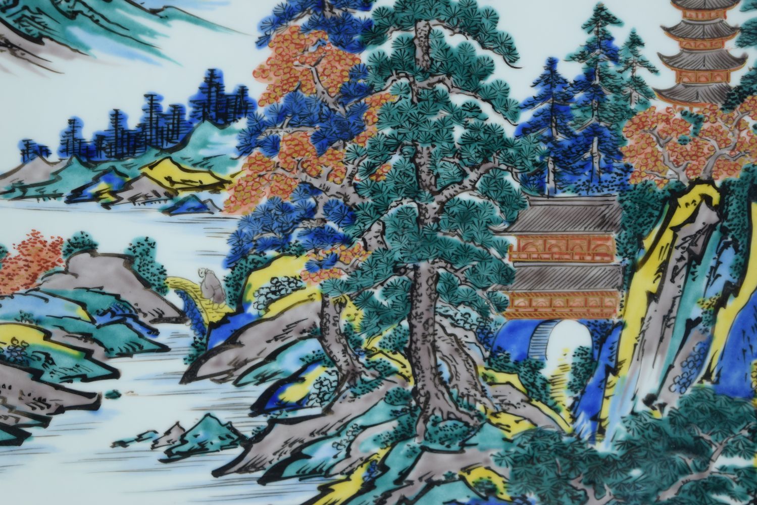 A large Japanese porcelain charger depicting a Pagoda in a landscape 45cm. - Image 2 of 5