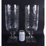 A LARGE PAIR OF CUT GLASS STORM CELERY VASES. 40 cm high.