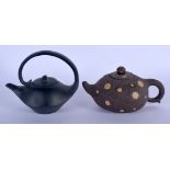 TWO CHINESE YIXING POTTERY TEAPOTS AND COVERS 20th Century. 14 cm x 13 cm. (2)