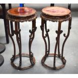 A FINE PAIR OF EARLY 20TH CENTURY CHINESE CARVED HARDWOOD STANDS with burr walnut inset panels, of e