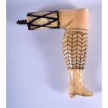 A RARE ANTIQUE CARVED BONE LEG WALKING CANE HANDLE. 8 cm x 9.5 cm.