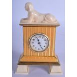 AN EARLY 20TH CENTURY EUROPEAN SILVER ENAMEL AND IVORY CLOCK formed with sphinxes. 11 cm x 6 cm.