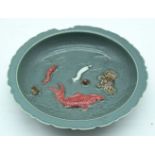 A Chinese bowl decorated with sea creatures. 22cm.