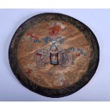 A 19TH CENTURY CHINESE CIRCULAR ORANGE SILKWORK ROUNDEL Late Qing, decorated with elephants. 24 cm d