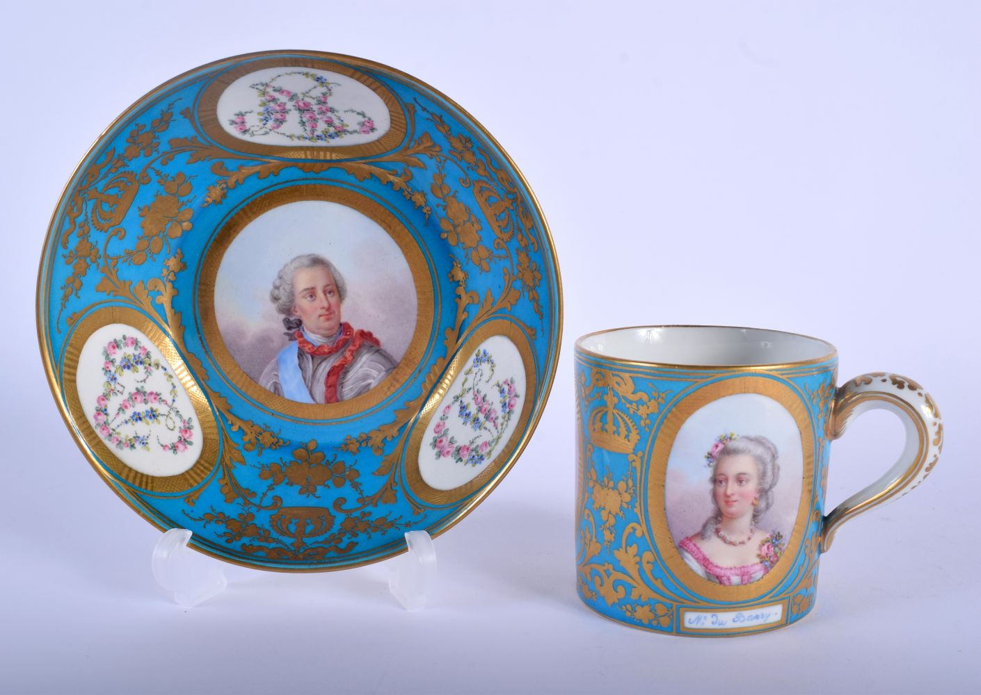 A FINE 19TH CENTURY SEVRES PORCELAIN CABINET CUP AND SAUCER painted with portraits and bands of foli