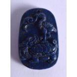 A CHINESE CARVED LAPIS LAZULI PENDANT 20th Century. 5 cm x 3.5 cm.