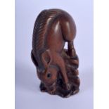 A JAPANESE BOXWOOD HORSE NETSUKE. 6 cm x 2 cm.