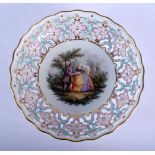 A LARGE 19TH CENTURY MEISSEN PORCELAIN RETICULATED PORCELAIN BOWL painted with lovers within a lands