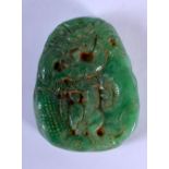 A CHINESE CARVED JADE ROUNDEL 20th Century. 3.5 cm x 5 cm.