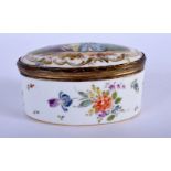 AN ANTIQUE EUROPEAN PORCELAIN PILL BOX AND COVER. 11 cm x 4 cm.