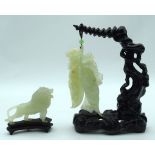 A Jade fruiting pod on a stand together with a jade Lion on a stand 24 x 16cm (4)
