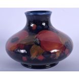 A WILLIAM MOORCROFT BULBOUS POMEGRANATE VASE decorated with fruit. 11 cm x 11 cm.