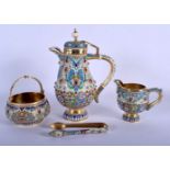 AN UNUSUAL CONTINENTAL SILVER AND ENAMEL JEWELLED COFFEE POT with matching sugar basket, tongs and c