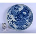 A LARGE CHINESE BLUE AND WHITE PORCELAIN CHARGER 20th Century, painted with dragons. 35 cm diameter.