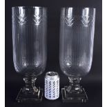 A LARGE PAIR OF CUT GLASS STORM CELERY VASES. 40 cm high.