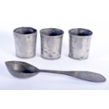 THREE ANTIQUE PEWTER BEAKERS together with an early spoon. Largest 24.5 cm long. (4)