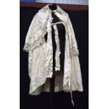 A Victorian silk house coat, a lace skirt and a bed set (5).